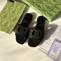 Black Interlocking G canvas slides
